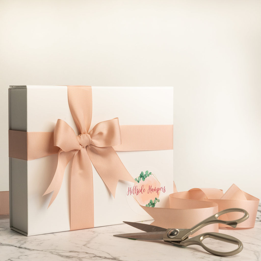 white New Baby gift box with ribbon
